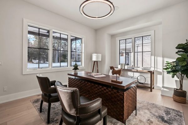 a living room filled with furniture and a large window