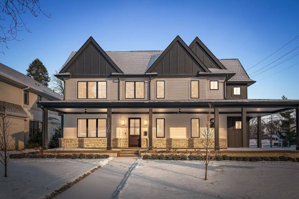 a close up of a street in front of a house with Shakespeare's Birthplace in the background