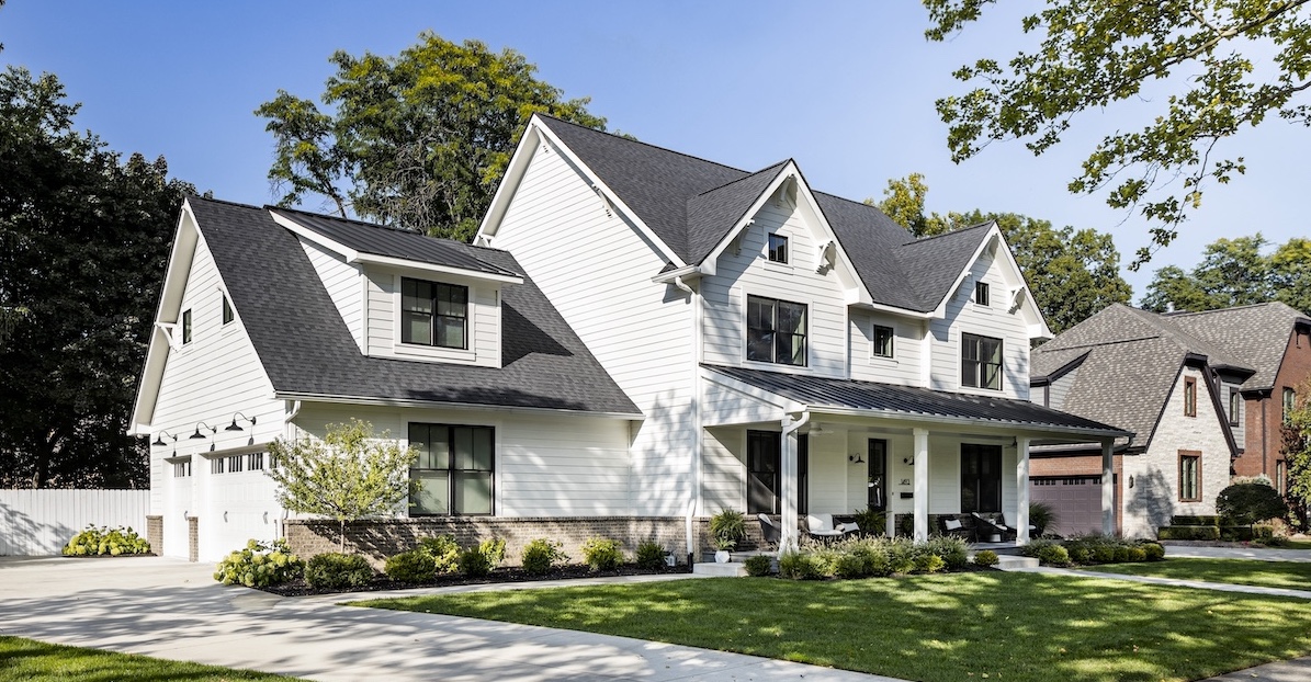 a small church in the front yard of a house