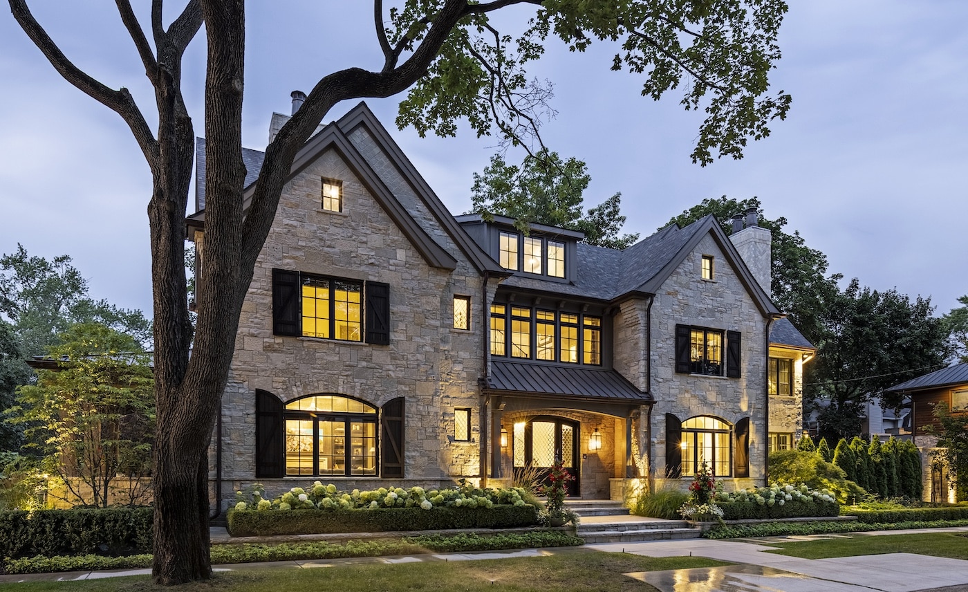 a tree in front of a house with Lake–Peterson House in the background