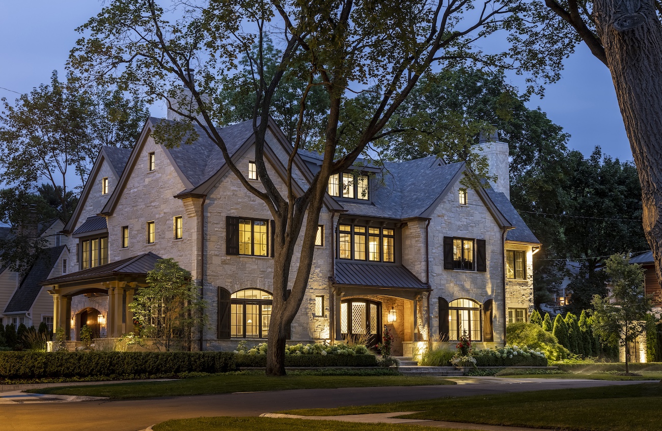 a large tree in front of a house