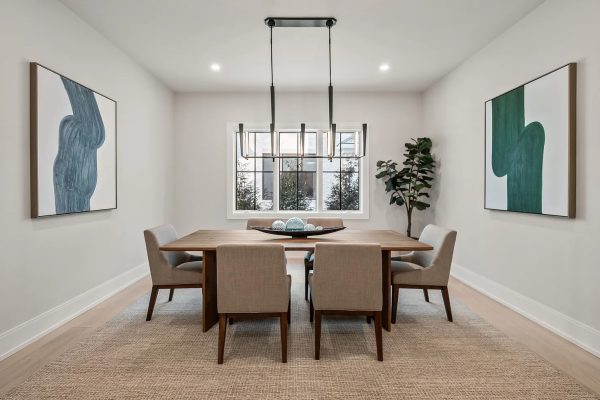 a living room filled with furniture and a large window