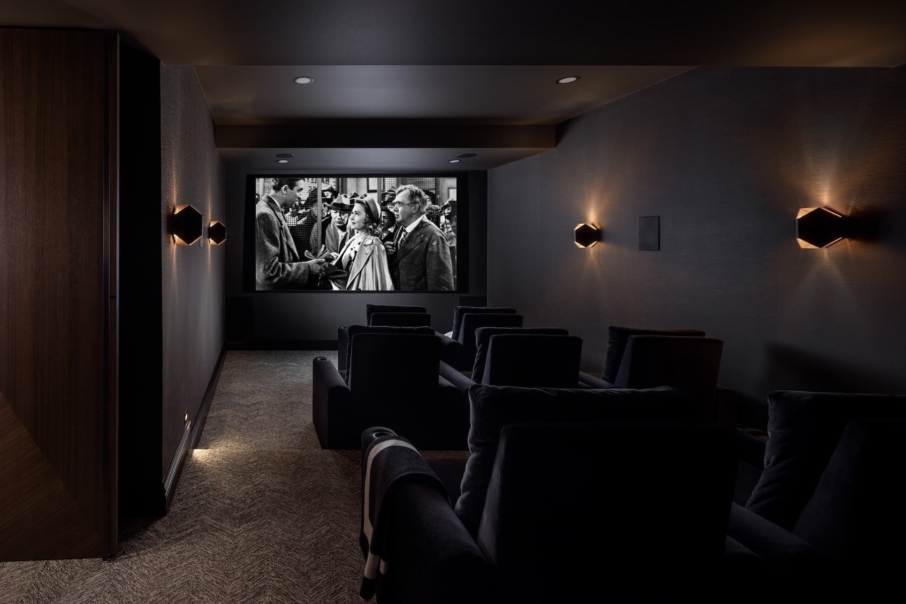 a bedroom with a bed in a dark room