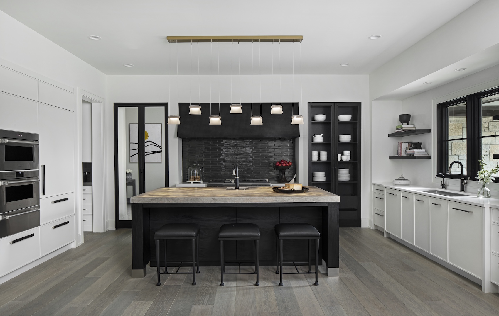 a room filled with furniture and a large window