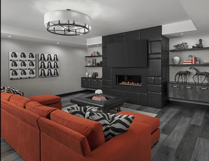 a living room filled with furniture and a flat screen tv