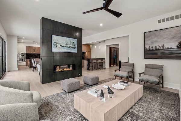 a living room filled with furniture and a large window