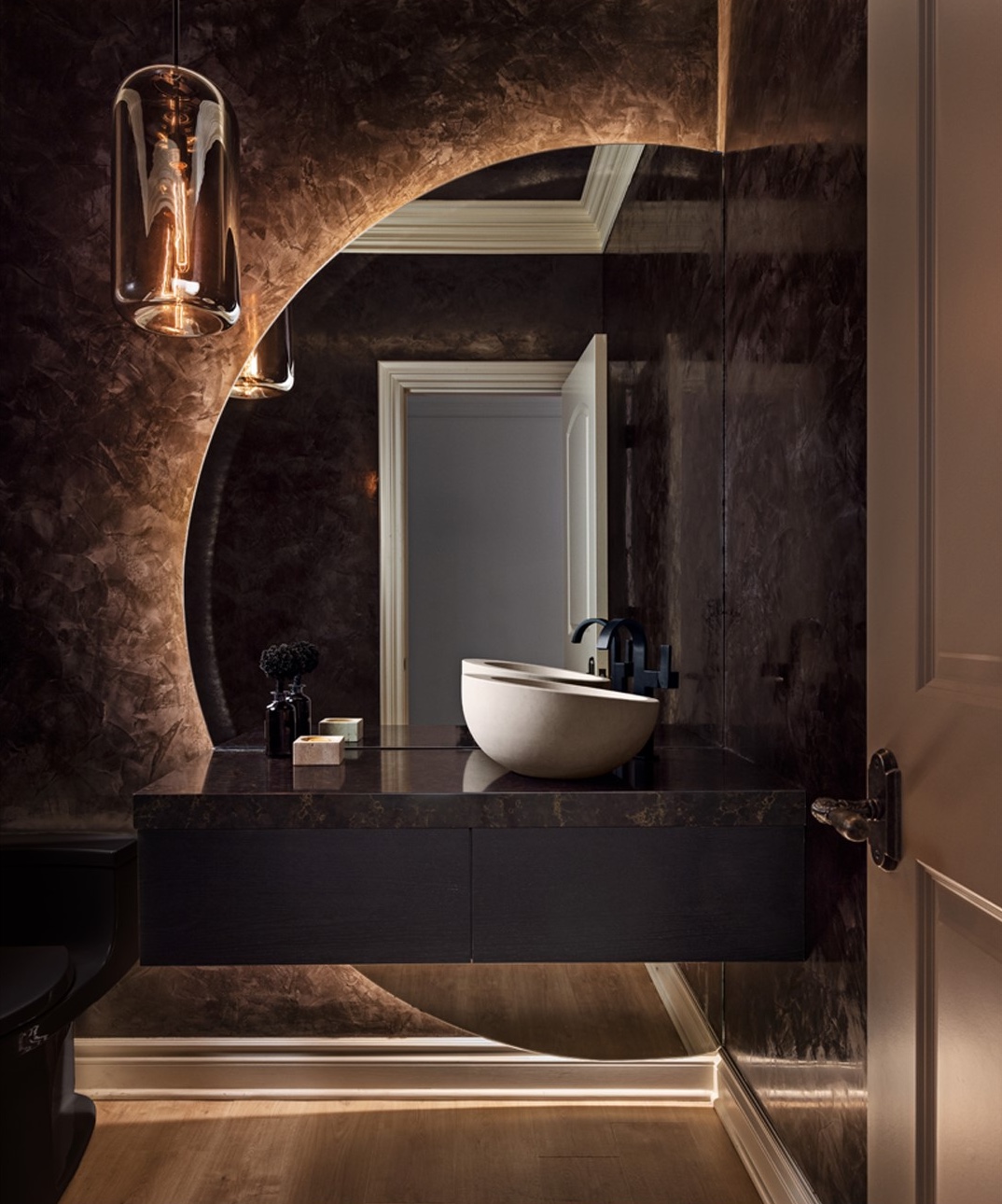 a room with a sink and a mirror