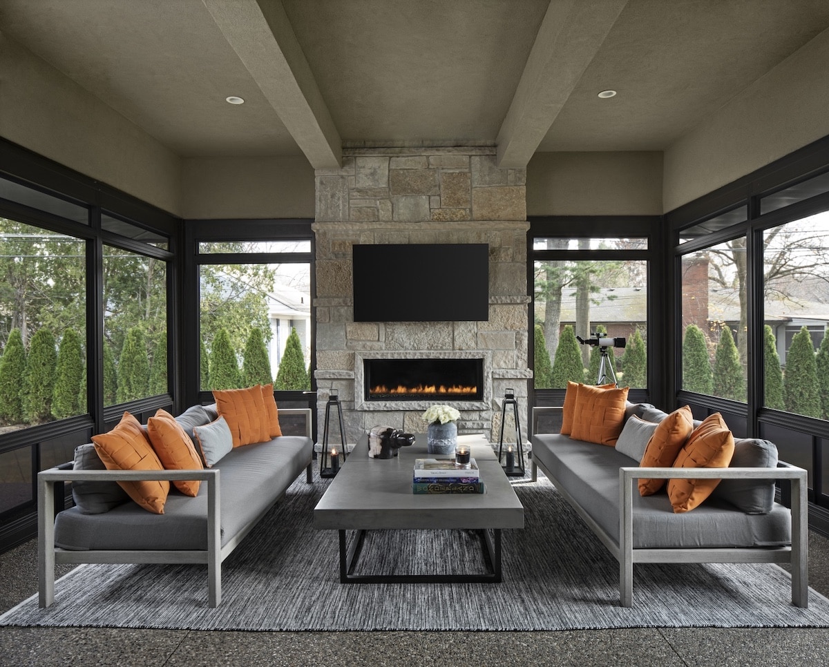 a living room filled with furniture and a large window